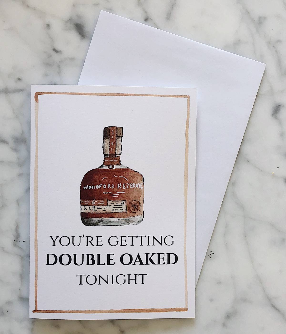 A bourbon Valentine's Day card with a bottle of Woodford Reserve DOuble Oaked and the phrase "you're getting double oaked tonight"