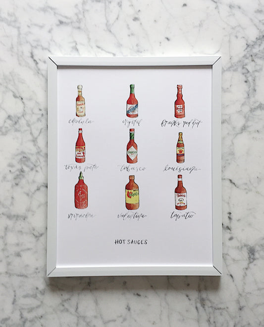 A fun watercolor art print of popular hot sauces with the name of each hot sauce displayed beneath each illustration - cholula, crystal, franks red hot, texas pete, tabasco, louisiana, sriracha, valentine, tapatio